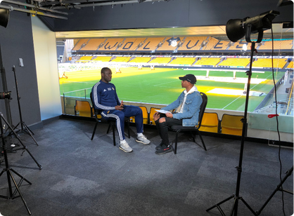 Behind-the-scenes interview setup at a stadium for 'Africans In Sports'.